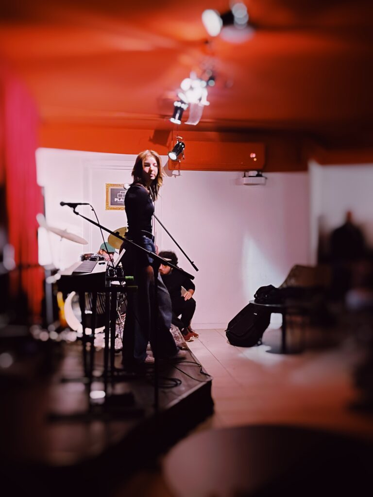 Live performance on stage at The Music Room open mic night